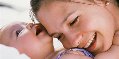 Mother embracing infant
